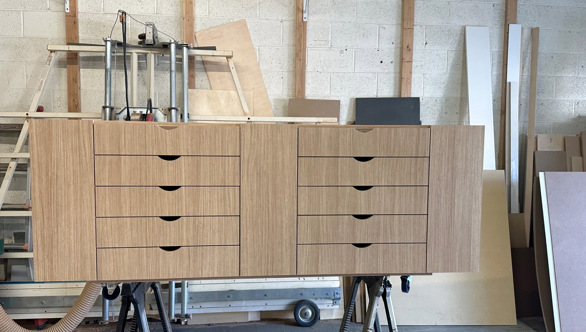 Handcrafted wood cabinet being completed inside the Burkee Designs workshop