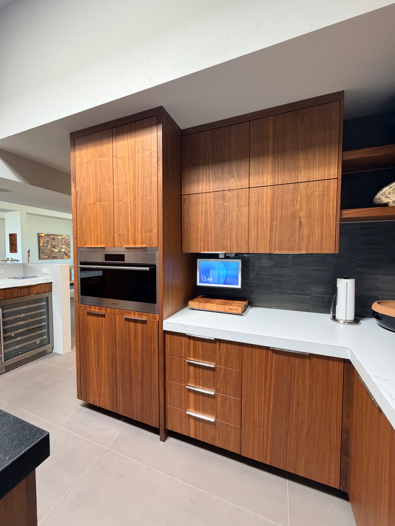 Detailed view of integrated walnut cabinet wall