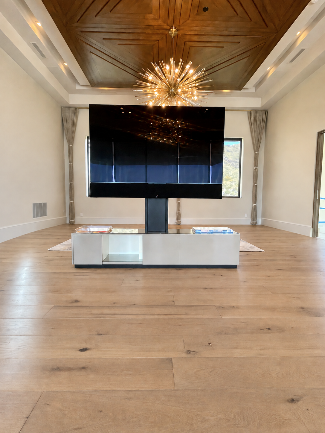 Clean straight-on view of the custom dual TV console by Burkee Designs