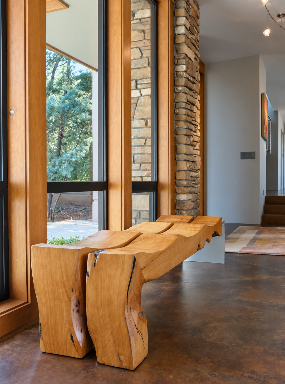 Sculptural wood entry bench by Burkee Designs